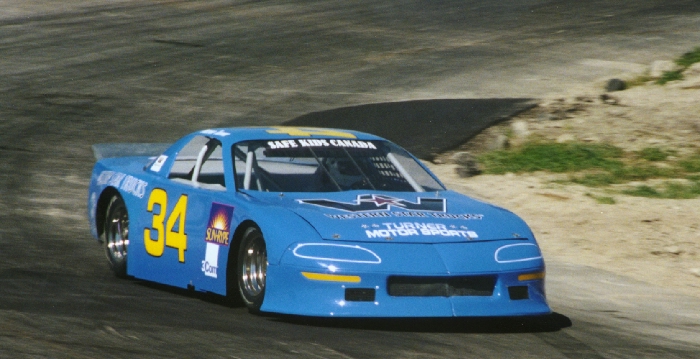 Darren Turner carving through turn 2 in afternoon practice Darren Turner carving through turn 2 in afternoon practice